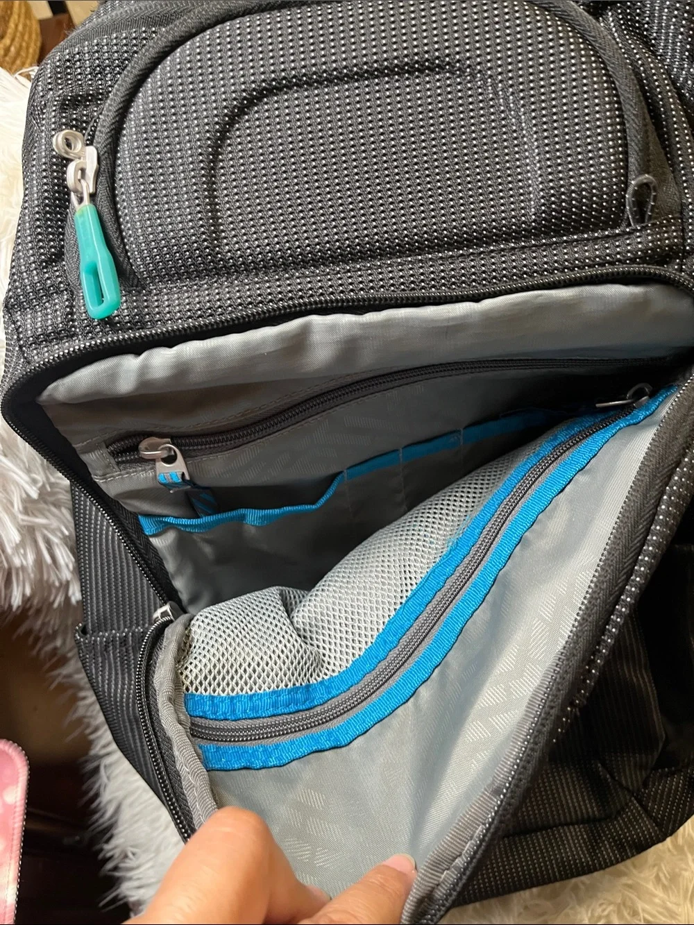 Thule Black Backpack with Teal Zipper Accents